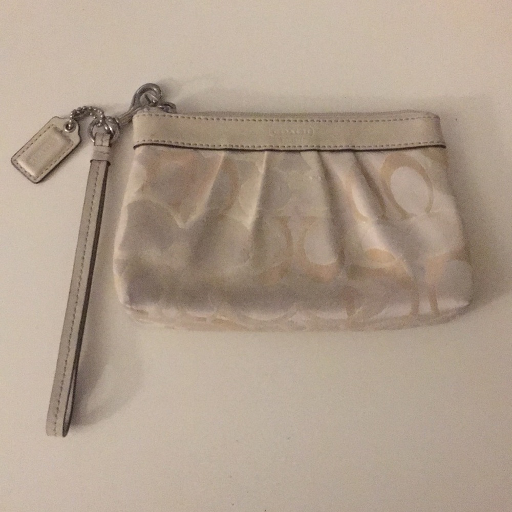 Cream coach wristlet